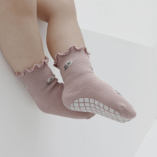 How do flexible soles in toddler shoes support natural foot movement?