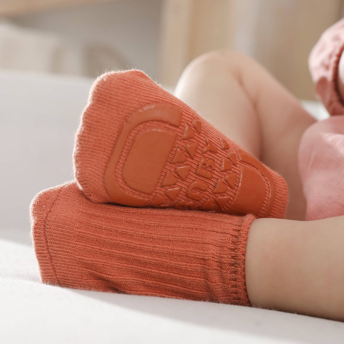 What are the signs that my baby's footwear is not suitable for their sensitive skin?