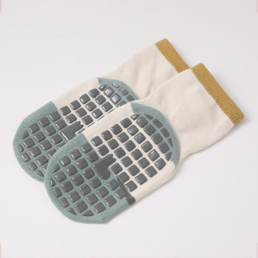 How should you wash and care for baby grip socks?