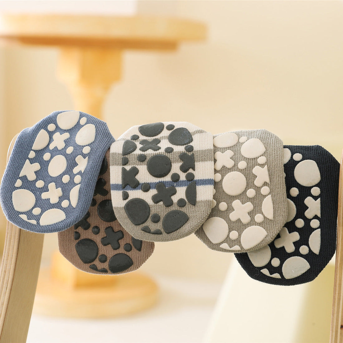 What role do soft-soled shoes play in a toddler's foot development?