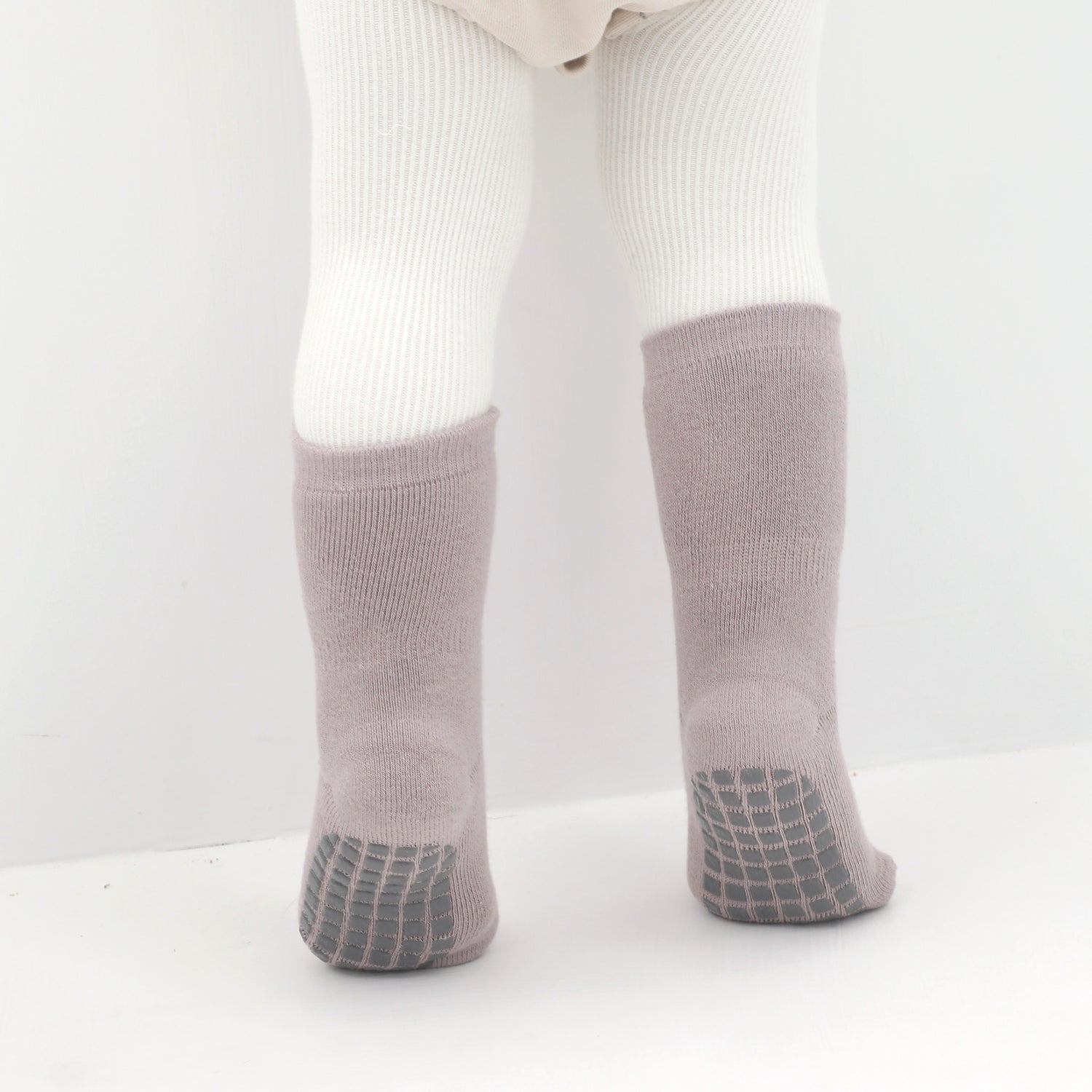 Baby socks with non-slip ankle grips for stability.