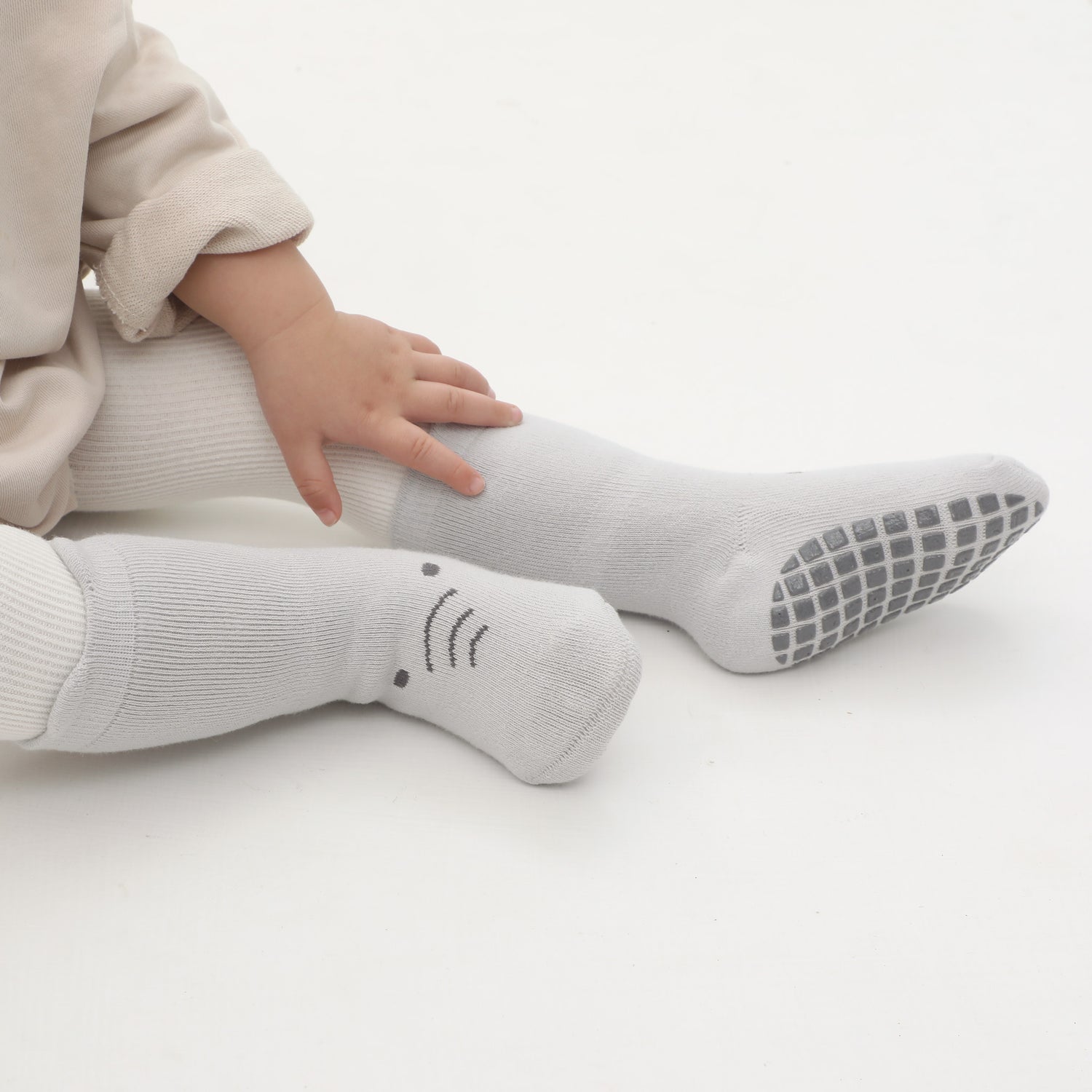 Babysoy's classic solid-colored socks, combining timeless style with non-slip safety.