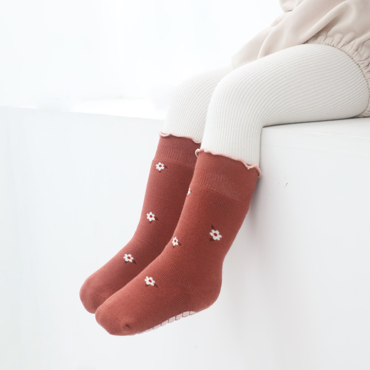 Sleek, socks designed to stay on small feet, perfect for a minimalist aesthetic.