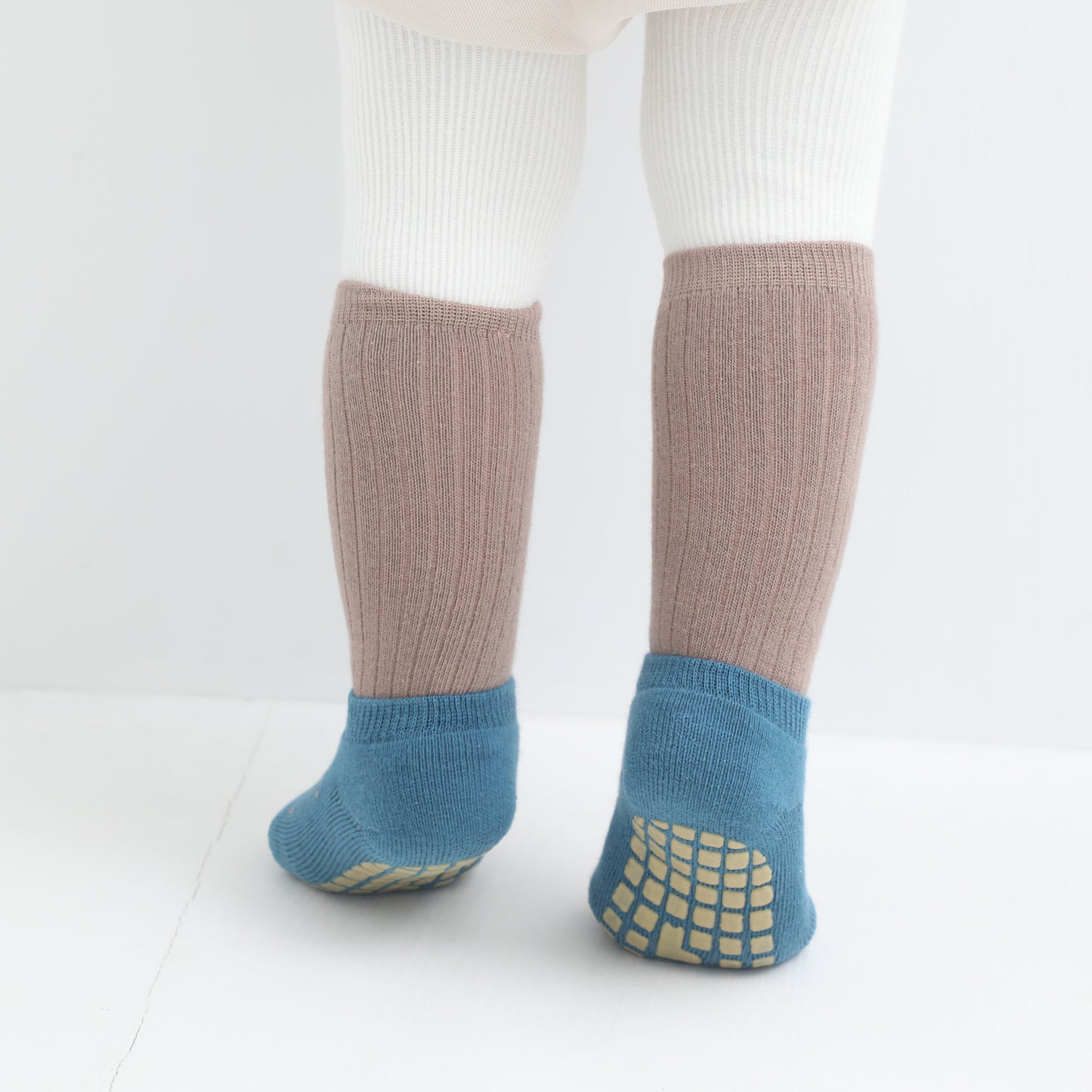 Classic look baby socks by Babysoy, solid colored with non-slip features for elegance and safety.