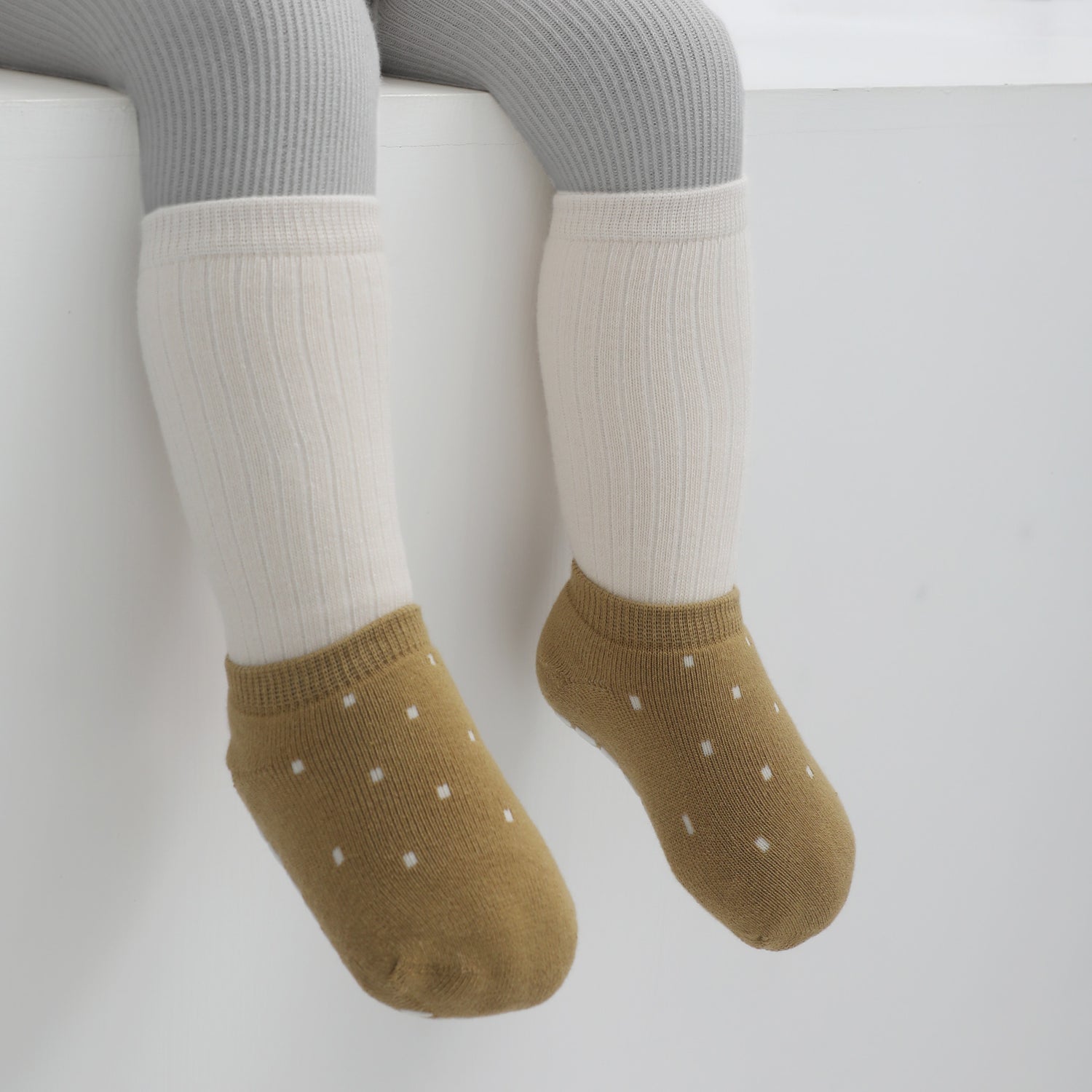 Cheerful and colorful non-slip skid socks for kids, decorated with entertaining grips.