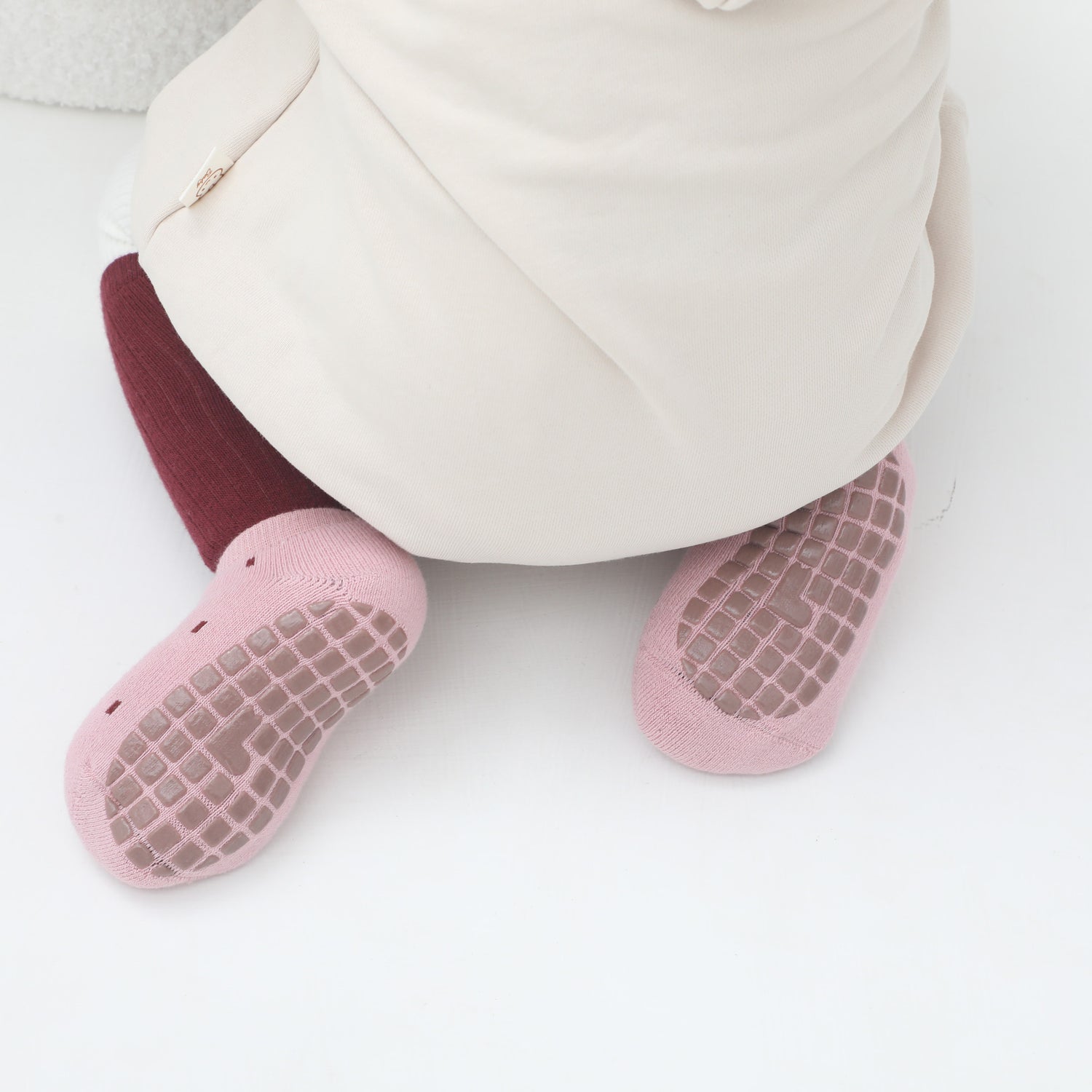 Baby non-skid socks with grips featuring playful patterns
