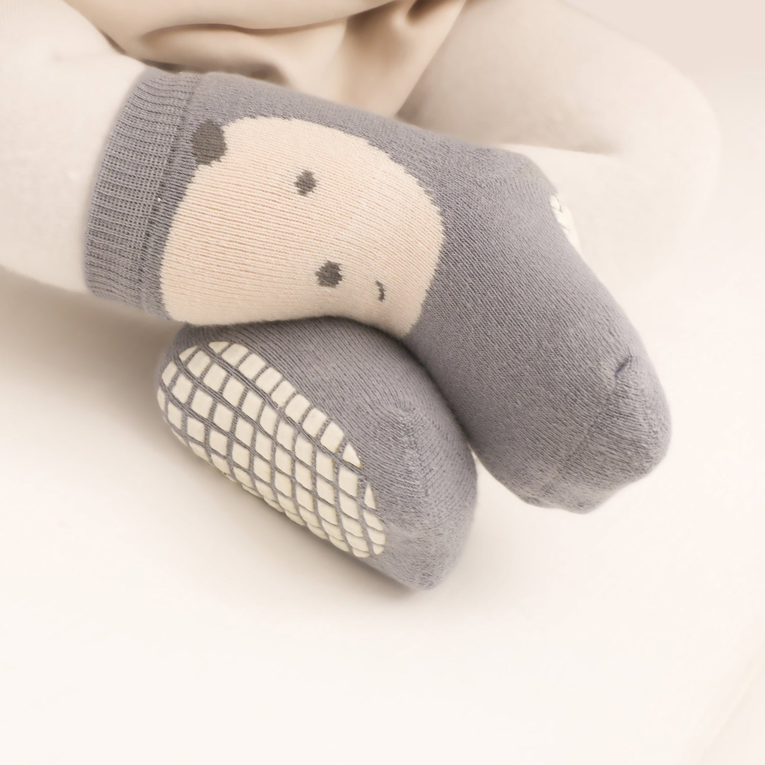 Non slip infant socks with sensory-friendly fabric