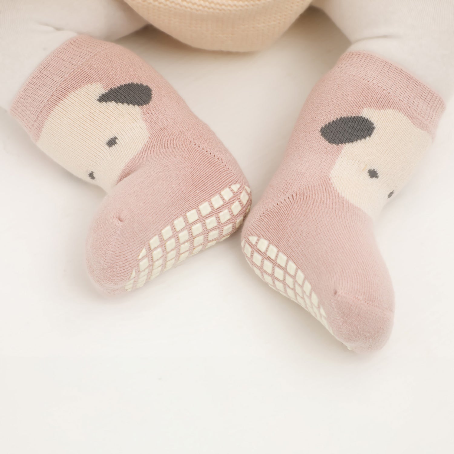 Comfortable ankle socks equipped with grips for a secure and snug fit for little ones.