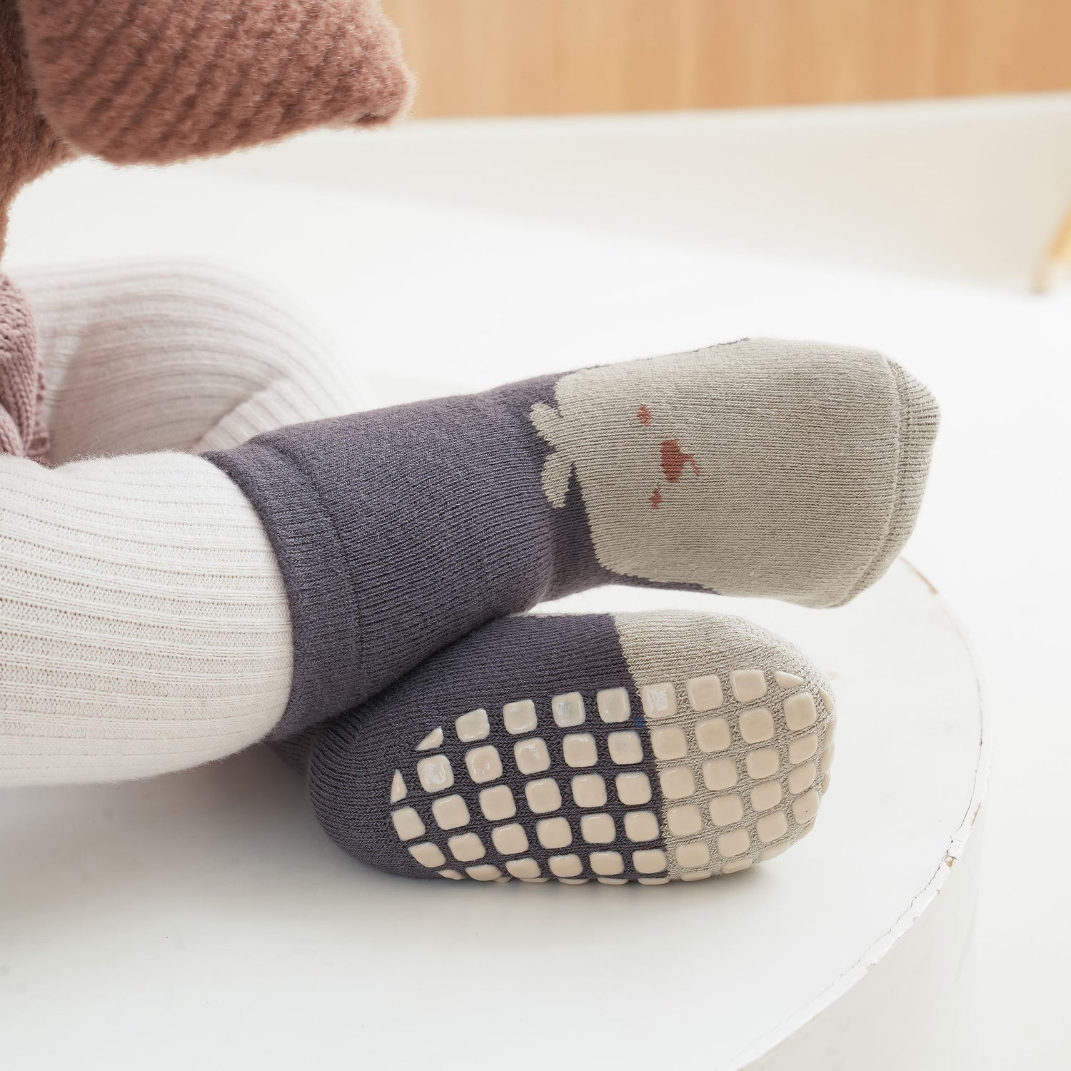 Snug, comfortable ankle socks with grips for small feet.