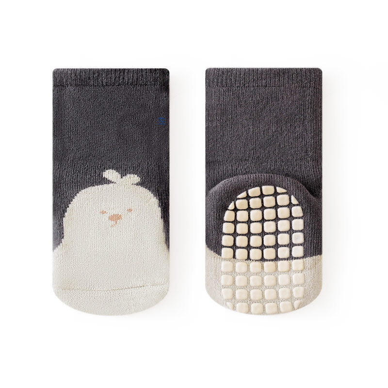 Infant grip socks blending safety with fun, designed for a sleek, minimalist look.